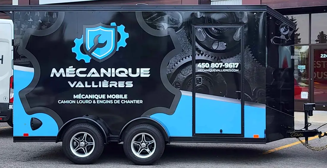 La remorque-atelier lettrée Mécanique Vallières : mécanique mobile, camion lourd et engins de chantier, 450 807-9617
